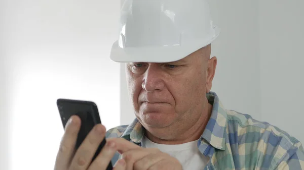 Upset Engineer Texting Mobile Phone Constructor Sending Receiving Emails Cellphone — Stock Photo, Image