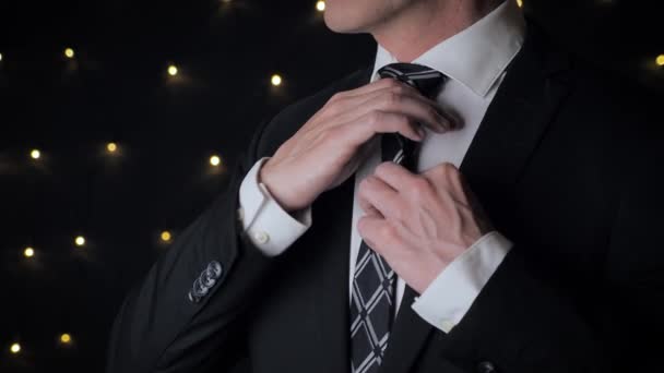 Close View Man Suit Adjusts His Tie Black Background Lights — Wideo stockowe