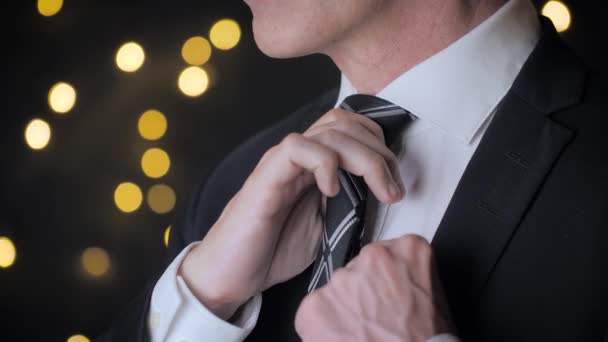 Close View Man Suit Adjusts His Tie Black Background Lights — Wideo stockowe