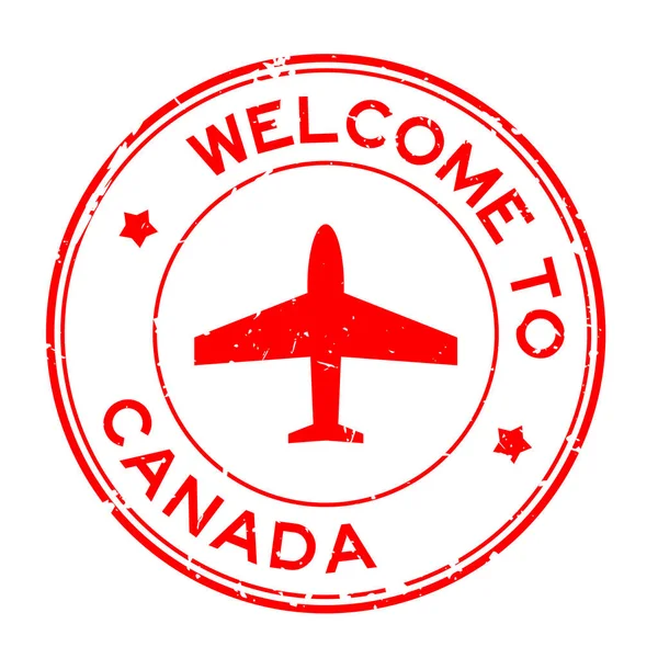 Grunge Rouge Bienvenue Canada Mot Avec Icône Avion Rond Tampon — Image vectorielle