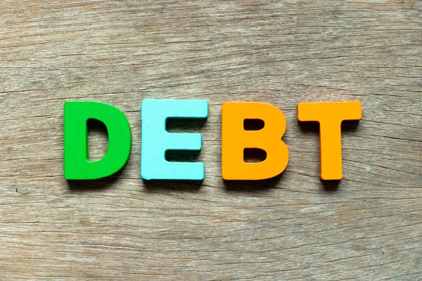 Farbe Alphabet Buchstabe Wort Schulden Auf Holz Hintergrund — Stockfoto