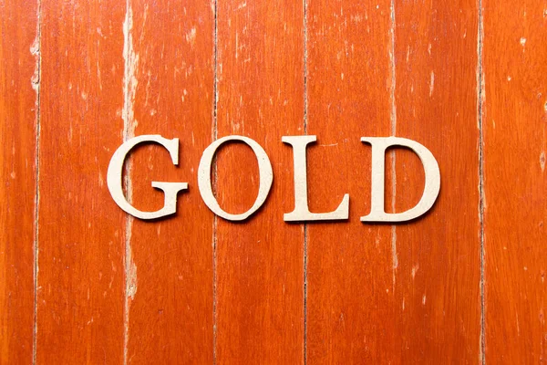 Lettera Alfabeto Oro Parola Sfondo Vecchio Piatto Legno Colore Rosso — Foto Stock