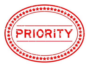 Grunge kırmızı öncelikli kelime oval lastik mühür beyaz arka planda