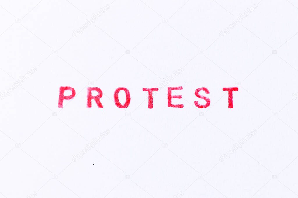 Red color ink rubber stamp in word protest on white paper background