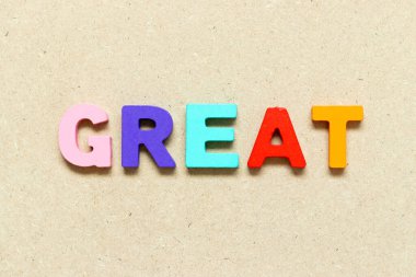 Color alphabet letter with word great on wood background