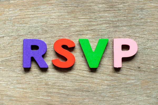 Color alphabet letter in word RSVP  on wood background