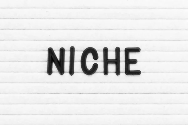 Black Color Letter Word Niche White Felt Board Background — Stock Photo, Image