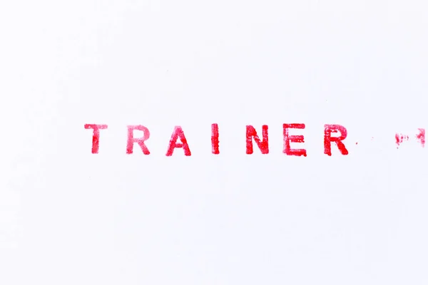 白い紙の背景に単語トレーナーの赤い色のインクゴムスタンプ — ストック写真
