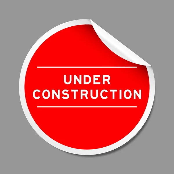 Étiquette Autocollante Couleur Rouge Avec Mot Construction Sur Fond Gris — Image vectorielle