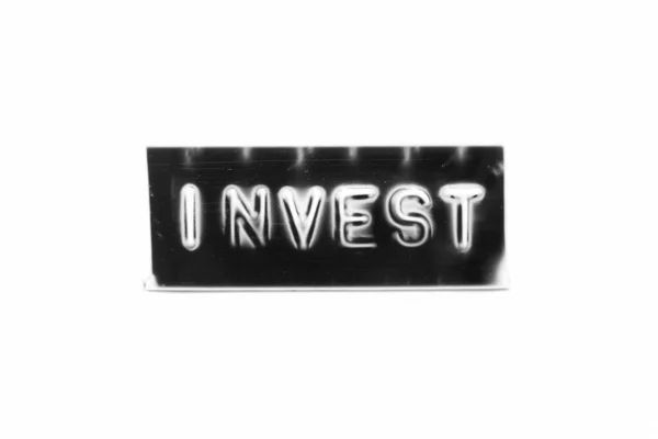 Черный Цветовой Баннер Тиснением Буквы Словом Инвестировать Белом Бумажном Фоне — стоковое фото