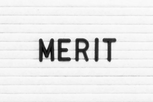 Black Color Letter Word Merit White Felt Board Background — ストック写真