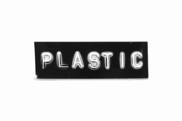 Черный Цветной Баннер Тиснением Буквы Словом Пластик Белом Бумажном Фоне — стоковое фото