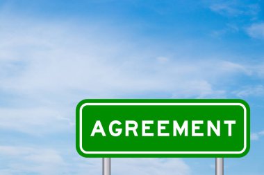 Green color transportation sign with word agreement on blue sky with white cloud background