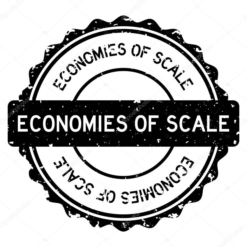 Grunge black economies of scale word round rubber seal stamp on white background