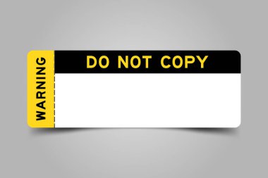Yellow and black color ticket with word warning and do not copy and have white copy psace on gray background clipart