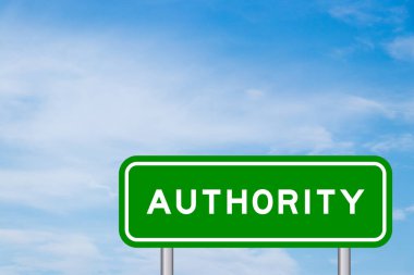 Green color transportation sign with word authority on blue sky with white cloud background