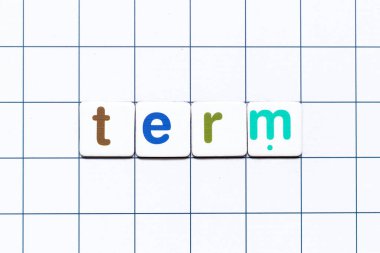 Colorful tile letter in word term on white grid background