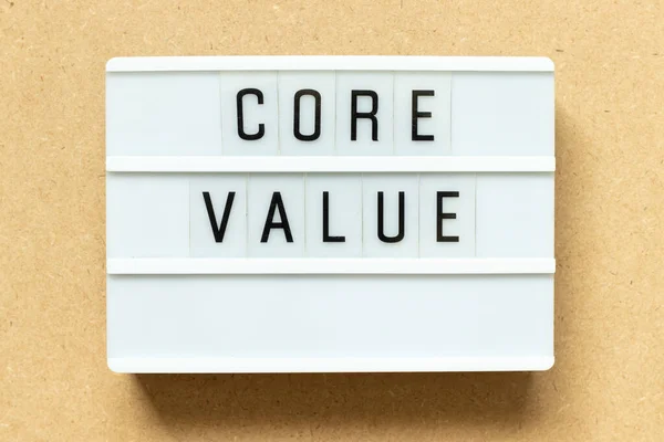 Lightbox with word core value on wood background