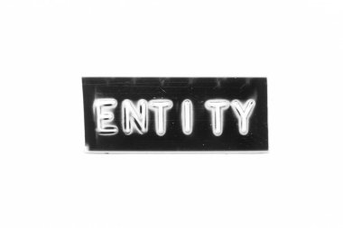 Black color banner that have embossed letter with word entity on white paper background
