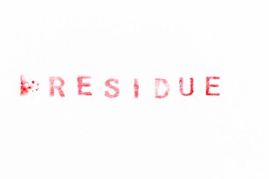 Red color ink rubber stamp in word residue on white paper background
