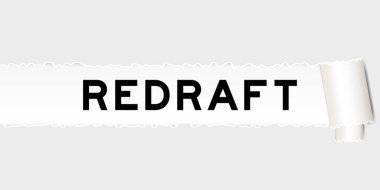 Ripped gray paper background that have word redraft under torn part