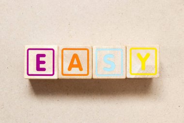 Color letter block in word easy on wood background