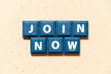 Tile letter in english word join now on wood background