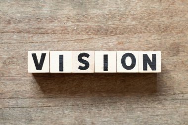 Alphabet letter block in word vision on wood background