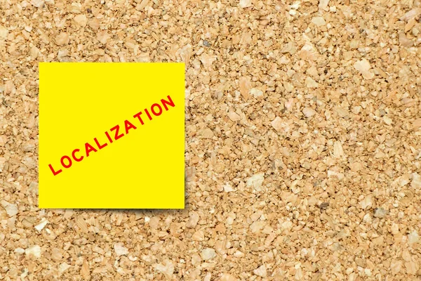 Yellow Note Paper Word Localization Cork Board Background Copy Space — Fotografia de Stock