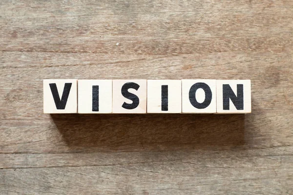 Alphabet letter block in word vision on wood background