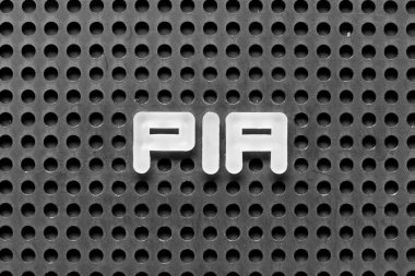 White alphabet letter in word PIA (abbreviation of Proprietary Information Agreement) on black pegboard background