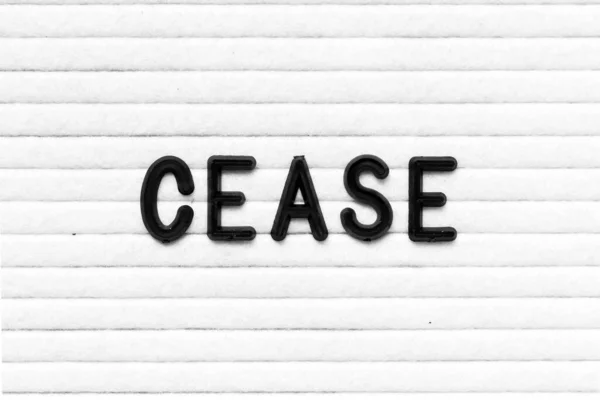 Black Color Letter Word Cease White Felt Board Background — Fotografia de Stock