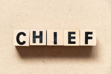 Alphabet letter block in word chief on wood background