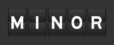 Black color analog flip board with word minor on gray background