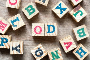 Alphabet letter block in word OD (Abbreviation of overdraft) and another letter on wood background