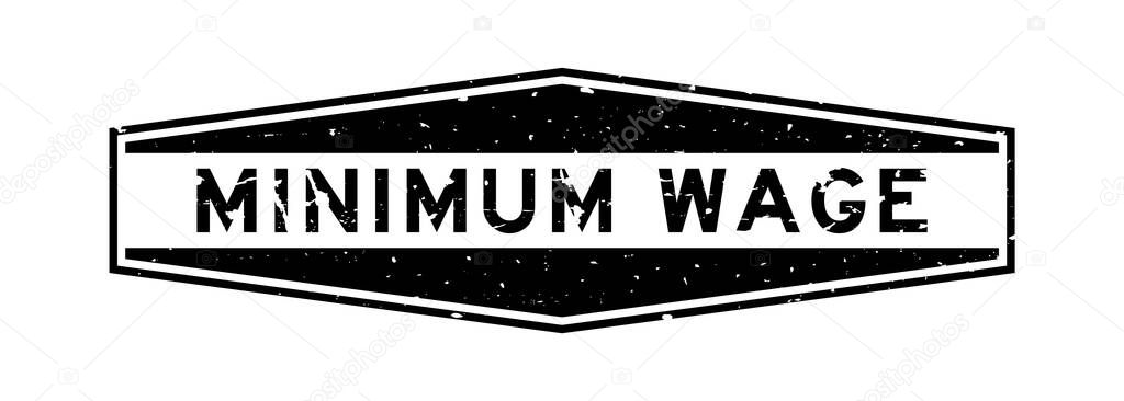 Grunge black minimum wage word hexagon rubber seal stamp on white background