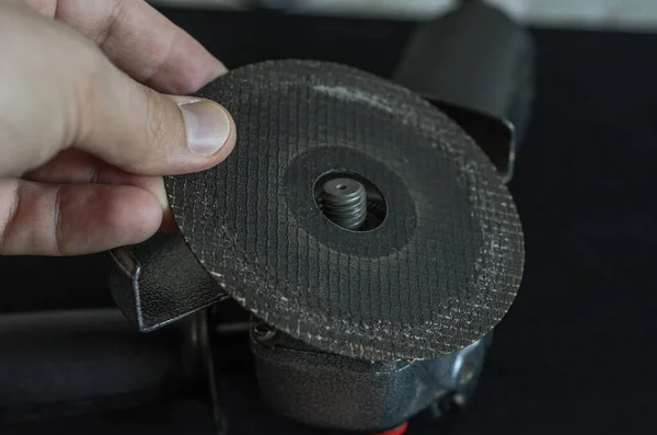 Master Installs Cutting Wheel Angle Grinder — Photo