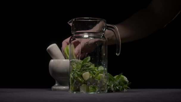 Pieces of lime are poured into jug — Vídeo de stock