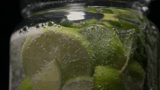 The process of creating a mojito, a close-up of the contents of the jug — Vídeo de stock