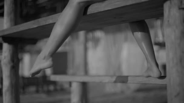 Girl Shakes Her Leg Feet Hanging Bench Close Marine Luxuxry — Video Stock