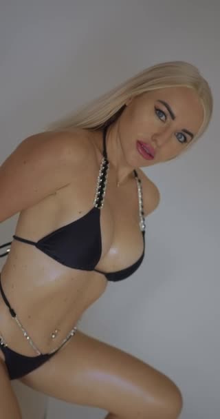 Young Blonde Woman Silicone Breasts Posing Photo Shoot Black Swimsuit — Stock Video