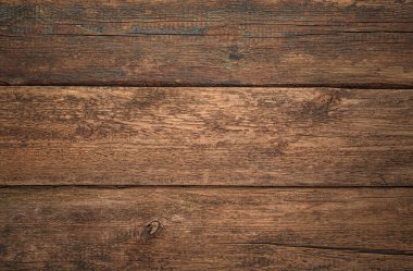 Ahşap arka plan. Arka planda çizikler olan eski tahtalar var. Üst görünüm.