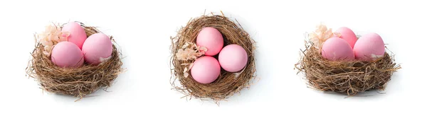 Trzy Gniazda Różowymi Jajkami Wielkanocnymi Pod Różnymi Kątami Odizolowane Białym — Zdjęcie stockowe