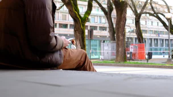 Boy Jacket Uses Smartphone Sitting Sidewalk — Stockvideo