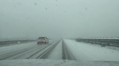 snowfall on the Italian highway from the passenger compartment