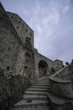 Sacra di San Michele in Turin, view from below of the cliff and walls. High quality photo