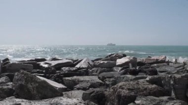 rocks and rough Ligurian sea in Italy Boccadasse. High quality 4k footage
