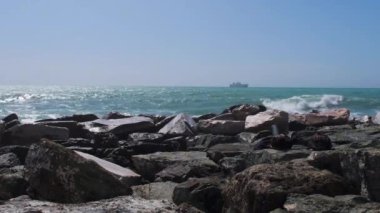 rocks and rough Ligurian sea in Italy Boccadasse. High quality 4k footage