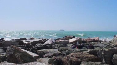 rocks and rough Ligurian sea in Italy Boccadasse. High quality 4k footage