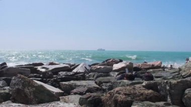 rocks and rough Ligurian sea in Italy Boccadasse. High quality 4k footage